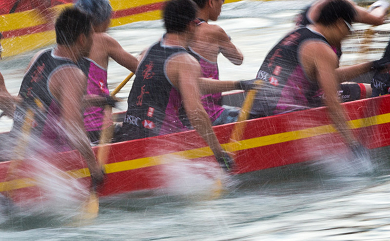 Competitors from HSBC take part in a dragon boat race